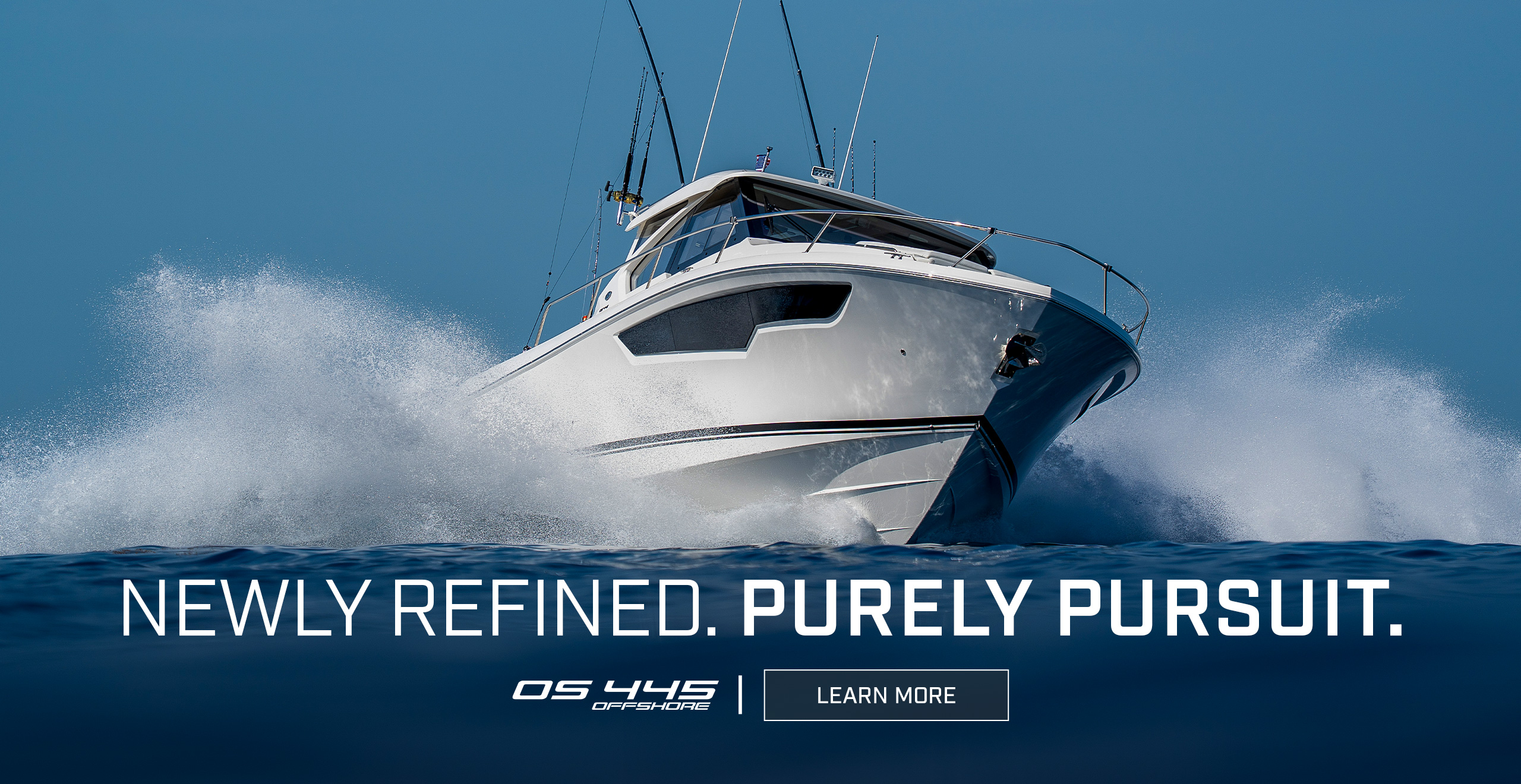 Pursuit OS 445 Offshore boat speeding through the ocean with waves and spray, beneath a clear blue sky; text reads NEWLY REFINED. PURELY PURSUIT. with OS 445 Offshore and a Learn More button.