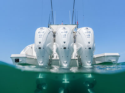 Over-under waterline view of the Yamaha XTO outboards on a Pursuit OS 445.