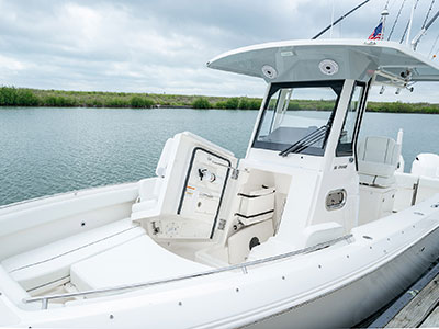 Detail of S 268 Sport center console boat with fiberglass head door open.