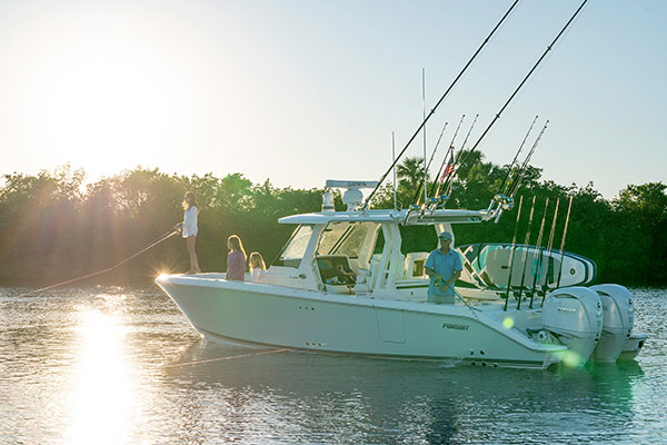 People fishing on a Pursuit Center Console boat.