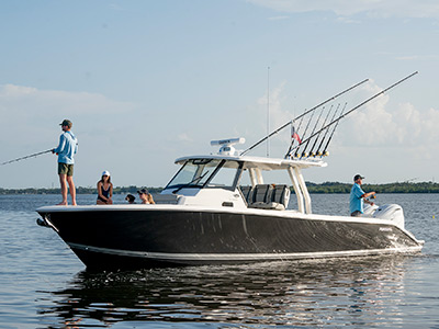 People fishing on the Pursuit Boat S 358 Sport Center Console fishing boat.