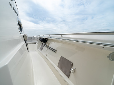 Walkway with handrails on a Pursuit Boat S 358 Sport Center Console boat.