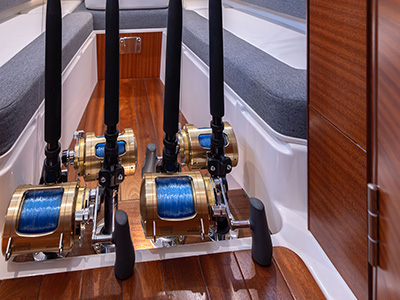 Dedicated storage for fishing rods in the cabin of the Pursuit S 388 Sport center console boat.
