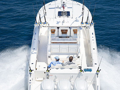 Shot of Pursuit Boats Center Console with triple Yamaha engines.