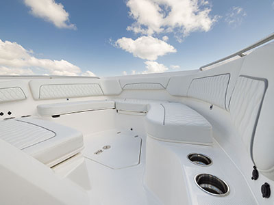 Spacious bow seating with storage on Pursuit CC S 388.