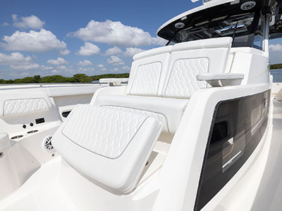 Forward lounge seating on Pursuit Center Console S 388 boat.