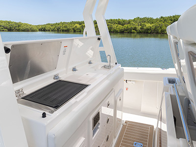 Entertainment center with grill and sink on Pursuit Boats S 388.