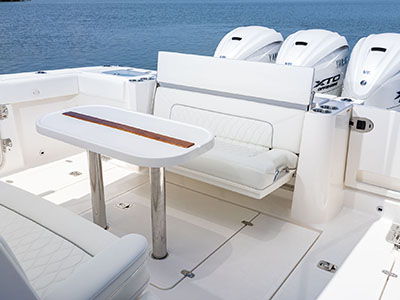With the transom seat open and table installed this versatile Pursuit Boat is ready to entertain.