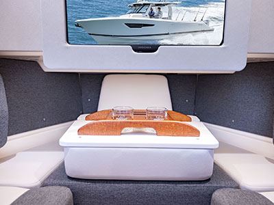 A convenient caddy can hold drinks, books and phones on the Pursuit S 388 Sport Center Console boat.