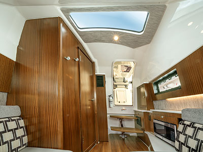 A shot of the luxurious cabin on the S 428 Pursuit Sport Center Console Boat.