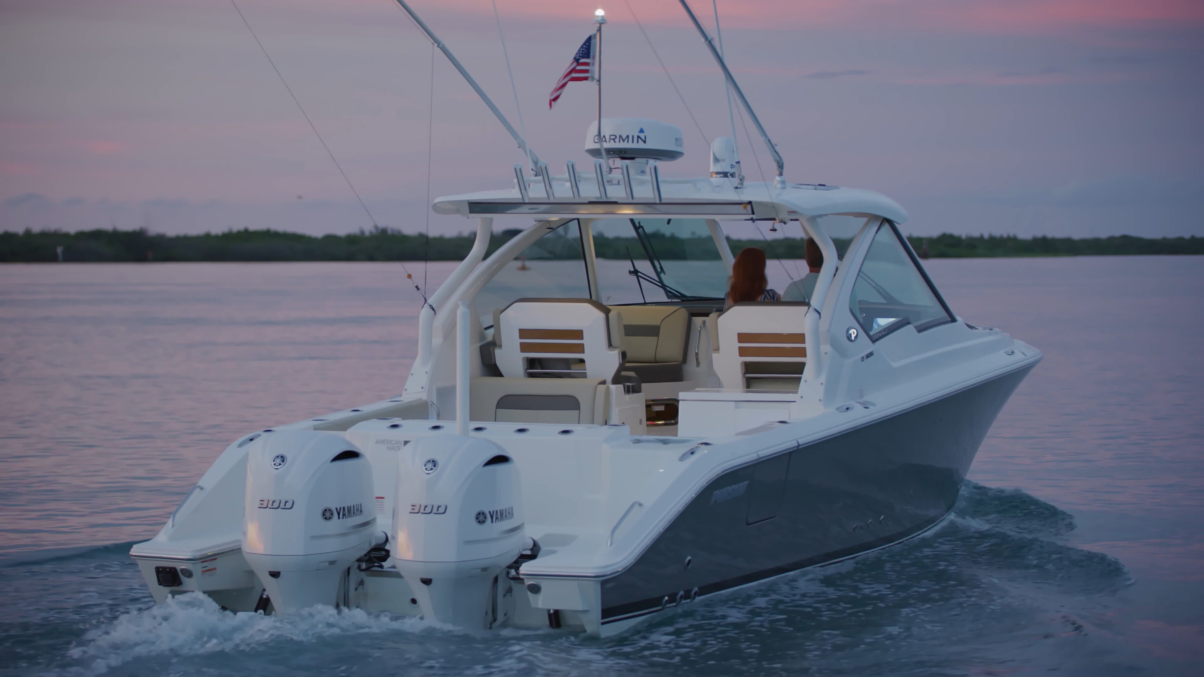 Aerial rear view of titanium D 326 Denali dual console boat.