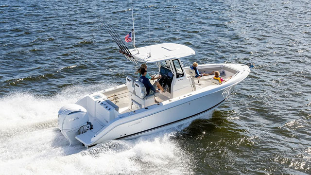Pursuit S 248 Center Console Sport Boat running right with Yamaha Engine.