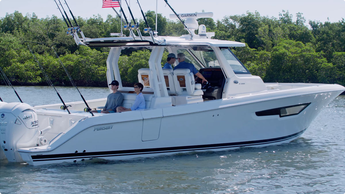 A family cruising on the Pursuit Boats S 388 Sport Center Console offshore fishing boat.