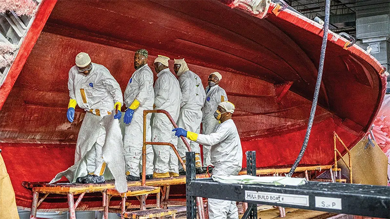 Pursuit Boats factory workers standing inside hull