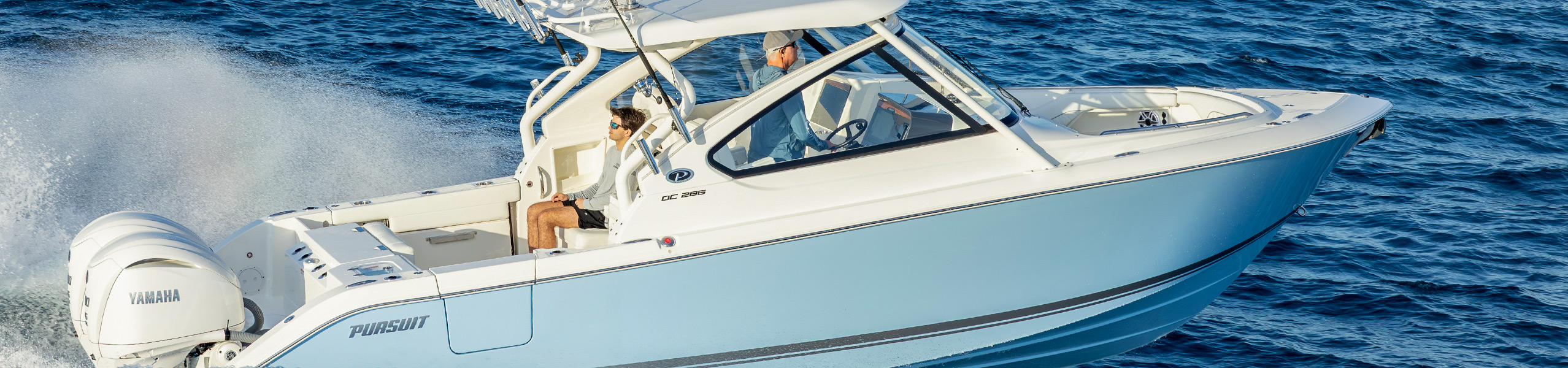 Pursuit DC 286 dual console breaking waves offshore.