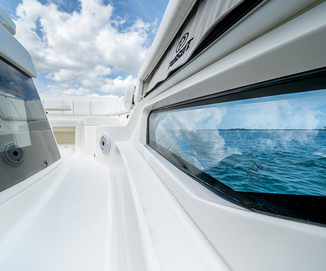 Detail view of port side hull window of S 428 Sport boat.