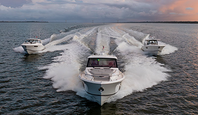 Pursuit flagship models DC 365, OS 445, and S 428 running toward the camera.